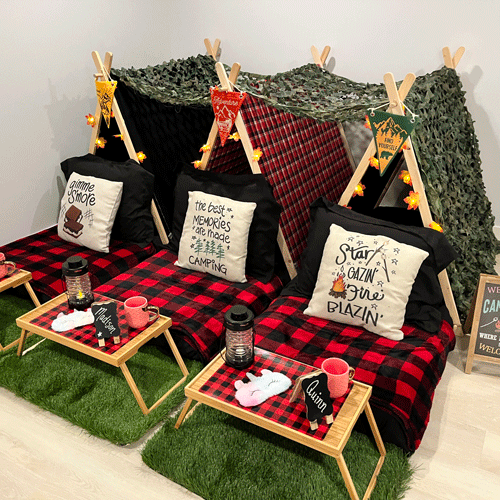 Camp Out themed sleepover fort party setup